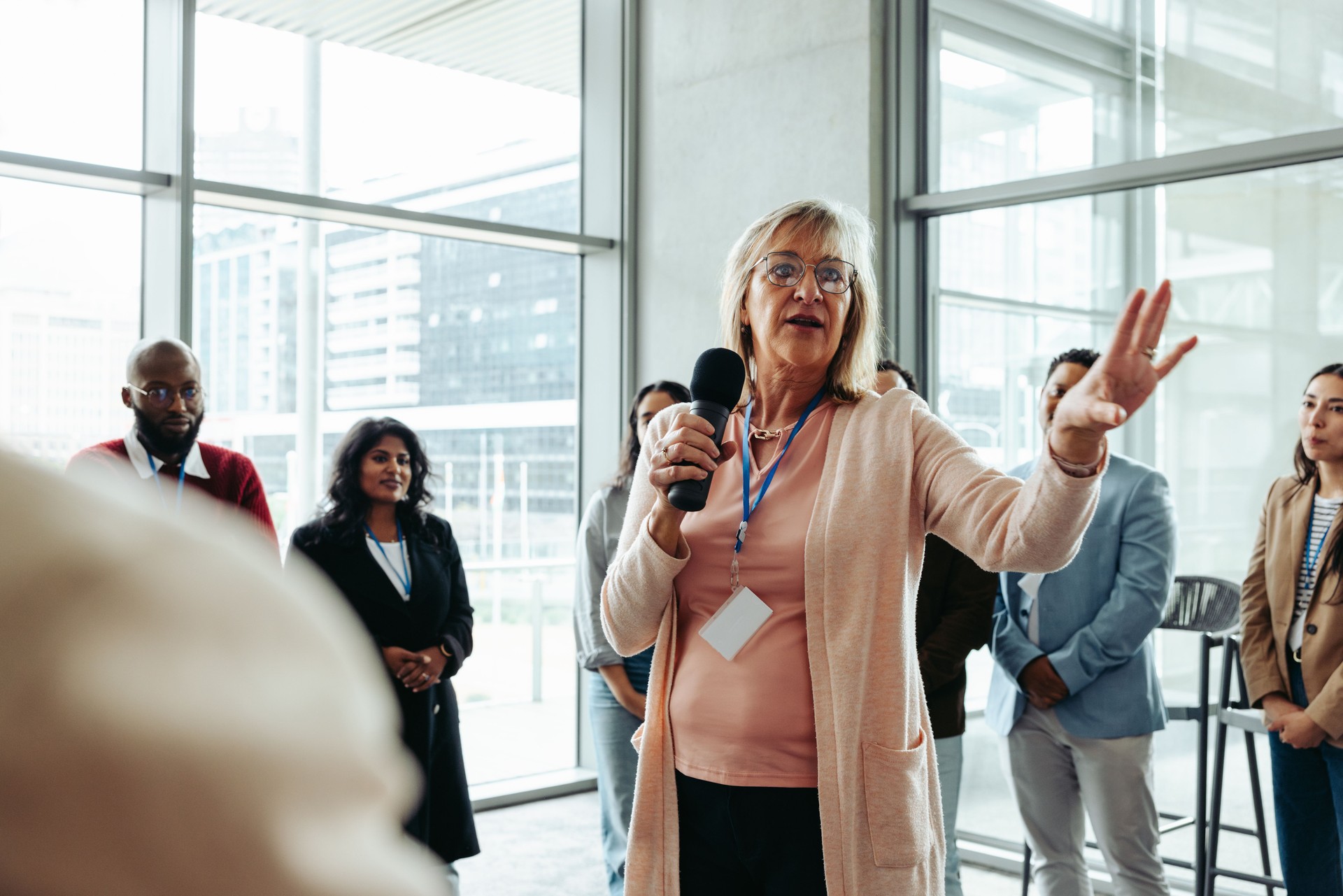 Confident businesswoman leading corporate conference with success