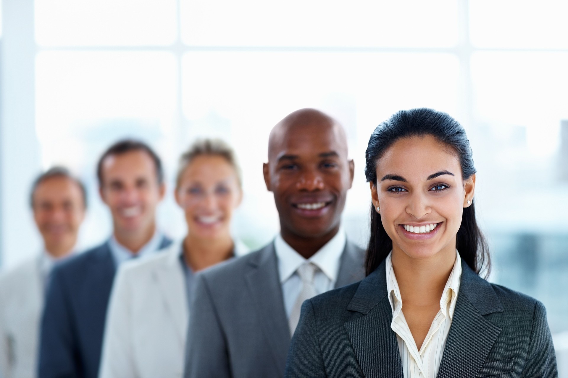 Businesswoman colleagues standing in a line and smiling